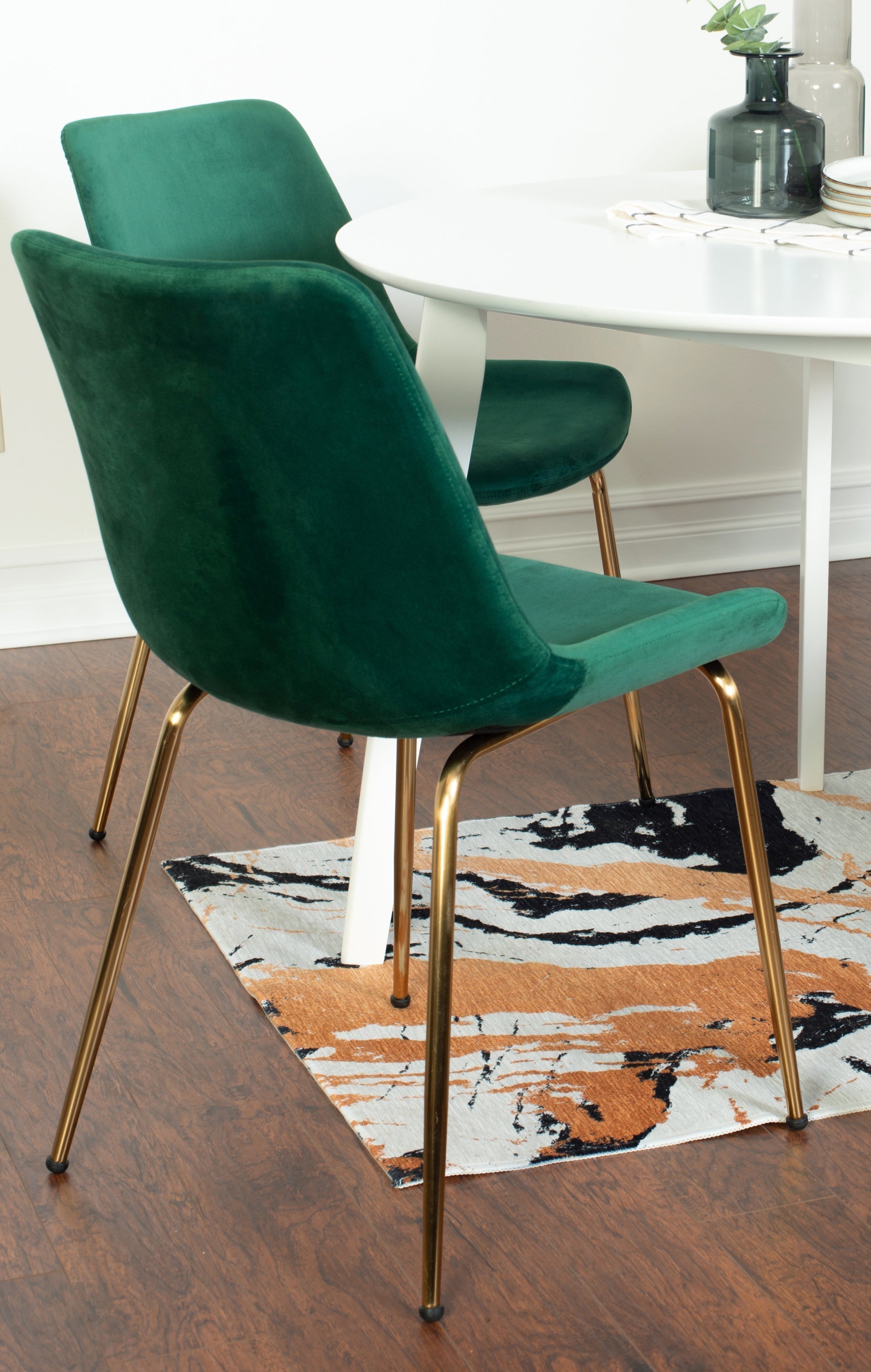 Contemporary White Round Dining Table with Two Gold-Accent Chairs